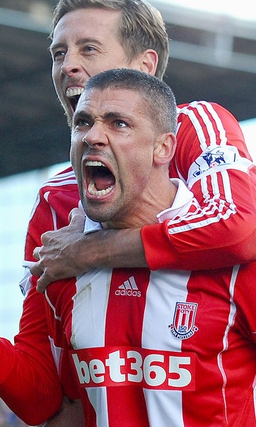 Arsenal fall four points behind leaders, beaten by Stoke City